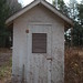 The outhouse behind the golf course