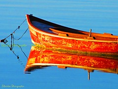 REFLECTION OF THE  FISHING BOAT