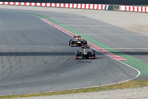 Mark Webber's Red Bull following the Lotus F1 car of Kimi Raikkonen at Formula One Winter Testing, Circuit de Catalunya, March 2012