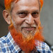 Trader with henna hair & henna beard at market in Ahmedabad, Gujarat, India