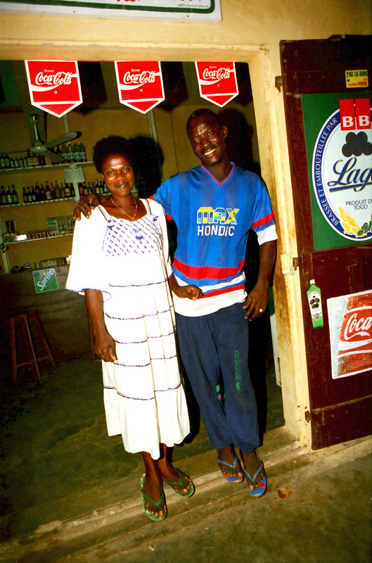 Togo West Africa Village Shop close to Palimé formerly known as Kpalimé is a city in Plateaux Region Togo near the Ghanaian border 24 April 1999 053<br/>© <a href="https://flickr.com/people/41087279@N00" target="_blank" rel="nofollow">41087279@N00</a> (<a href="https://flickr.com/photo.gne?id=13906789361" target="_blank" rel="nofollow">Flickr</a>)