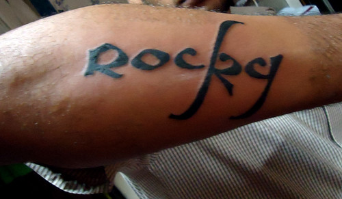 Hand poked Rocky Balboa portrait tattoo on the right