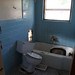Blue tiled bathroom in bad shape