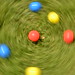 A photo where the movement of the camera creates an interesting blur effect - Coloured balls on grass • <a style="font-size:0.8em;" href="http://www.flickr.com/photos/58876504@N02/6779210159/" target="_blank">View on Flickr</a>
