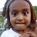 A Timorese girl intrigued  by the 'mali' on a Hash run