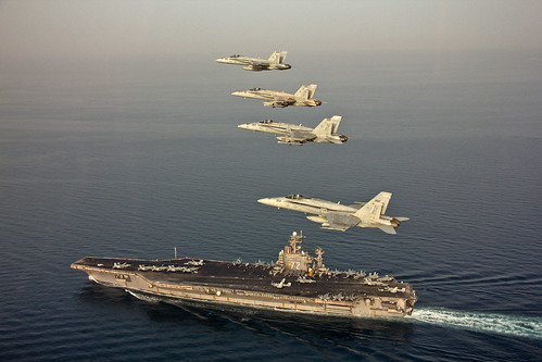 Jets fly in formation above USS Abraham Lincoln.