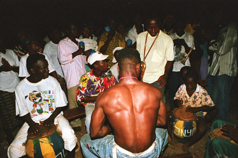 Togo West Africa Ethnic Cultural Dancing and Drumming African Village close to Palimé formerly known as Kpalimé a city in Plateaux Region Togo near the Ghanaian border 24 April 1999 175<br/>© <a href="https://flickr.com/people/41087279@N00" target="_blank" rel="nofollow">41087279@N00</a> (<a href="https://flickr.com/photo.gne?id=14013171291" target="_blank" rel="nofollow">Flickr</a>)