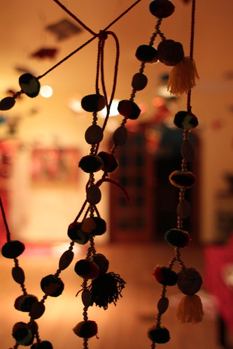 Installations viewed through beads from Abdullah Shah Ghazi shrine