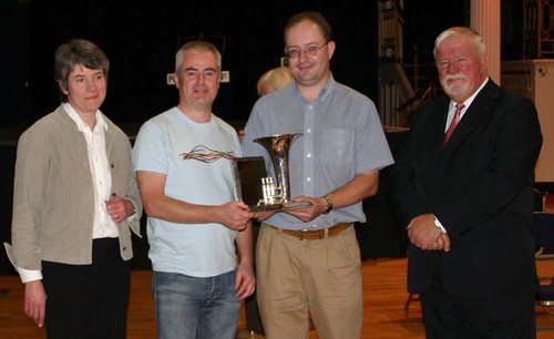Liz, Alan & Mark receive the Pip Hall Memorial Trophy from Contest Adjudicator, Roy Sparkes