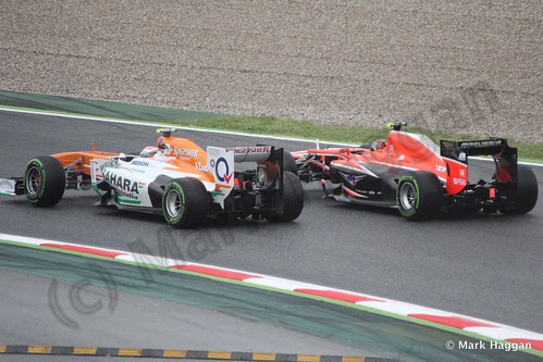 Adrian Sutil in his Force India and Rodolfo Gonzalez in the Marussia in Free Practice 1 at the 2013 Spanish Grand Prix