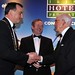 Michael Vaughan and An Taoiseach present the Presidents Award to Dr Tom Cavanagh
