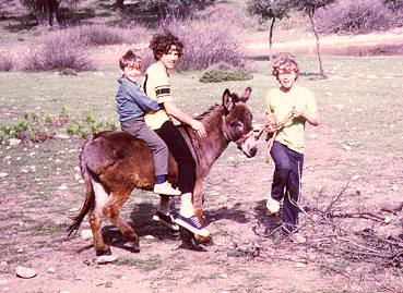 Chris, Dennis and Paul Browne riding there donkey Hercules in St. John's Cove, Thasos, Greece-1972