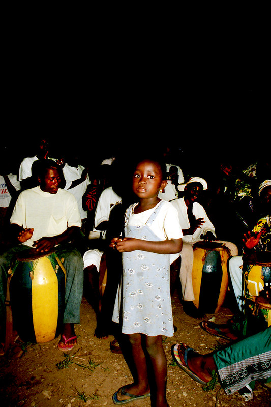 Togo West Africa Ethnic Cultural Dancing and Drumming African Village close to Palimé formerly known as Kpalimé a city in Plateaux Region Togo near the Ghanaian border 24 April 1999 133 Drumming<br/>© <a href="https://flickr.com/people/41087279@N00" target="_blank" rel="nofollow">41087279@N00</a> (<a href="https://flickr.com/photo.gne?id=14007572703" target="_blank" rel="nofollow">Flickr</a>)
