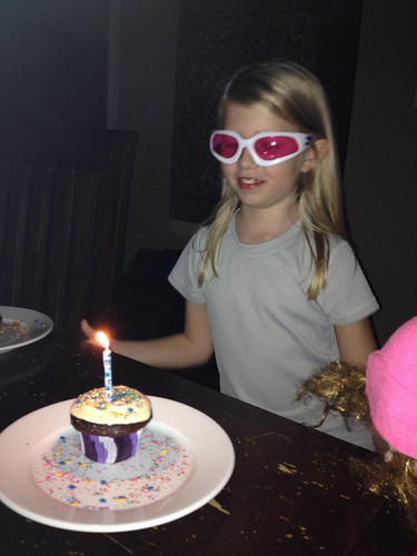 Nora blows out her candle while wearing her shooting goggles. • <a style="font-size:0.8em;" href="http://www.flickr.com/photos/96277117@N00/10062433033/" target="_blank">View on Flickr</a>