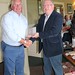 Con Cronin accpecting prize on behalf of John Walsh for nearest pin on 17th