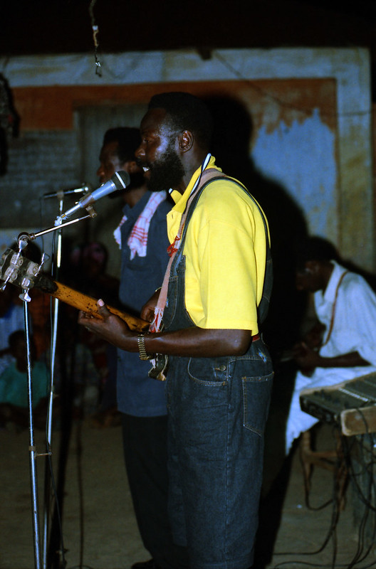 Togo West Africa Local Ethnic Cultural Orchestra Band and Show African Village close to Palimé formerly known as Kpalimé a city in Plateaux Region Togo near the Ghanaian border 23 April 1999 106<br/>© <a href="https://flickr.com/people/41087279@N00" target="_blank" rel="nofollow">41087279@N00</a> (<a href="https://flickr.com/photo.gne?id=13976709051" target="_blank" rel="nofollow">Flickr</a>)