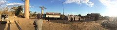 The scene near the sacred baobab - villagers, a big rice truck. (Laura iPhone Pano) Madagascar July, 2014