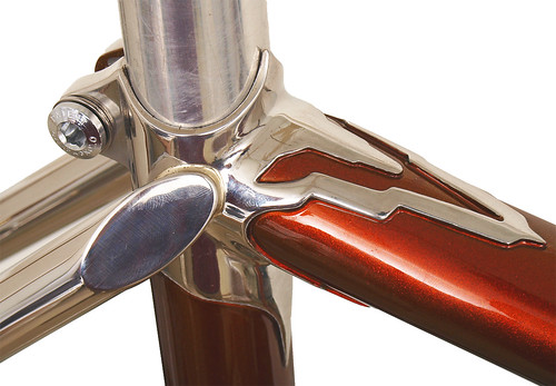 <p>Seat cluster detail of a Waterford 22-Series frame with custom Empire (art deco) lugs, painted Copper Metallic, with flat cap seat stay treatment and stainless seatstays.</p>