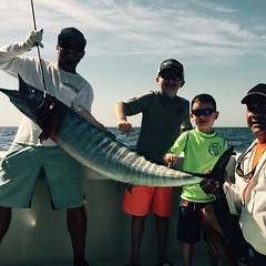 Capt. Manny catches a 50+ pound Wahoo in the kite.