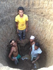 Hand digger's of well hit water