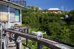 A drone sits atop a ledge waiting for a flight over Bali.